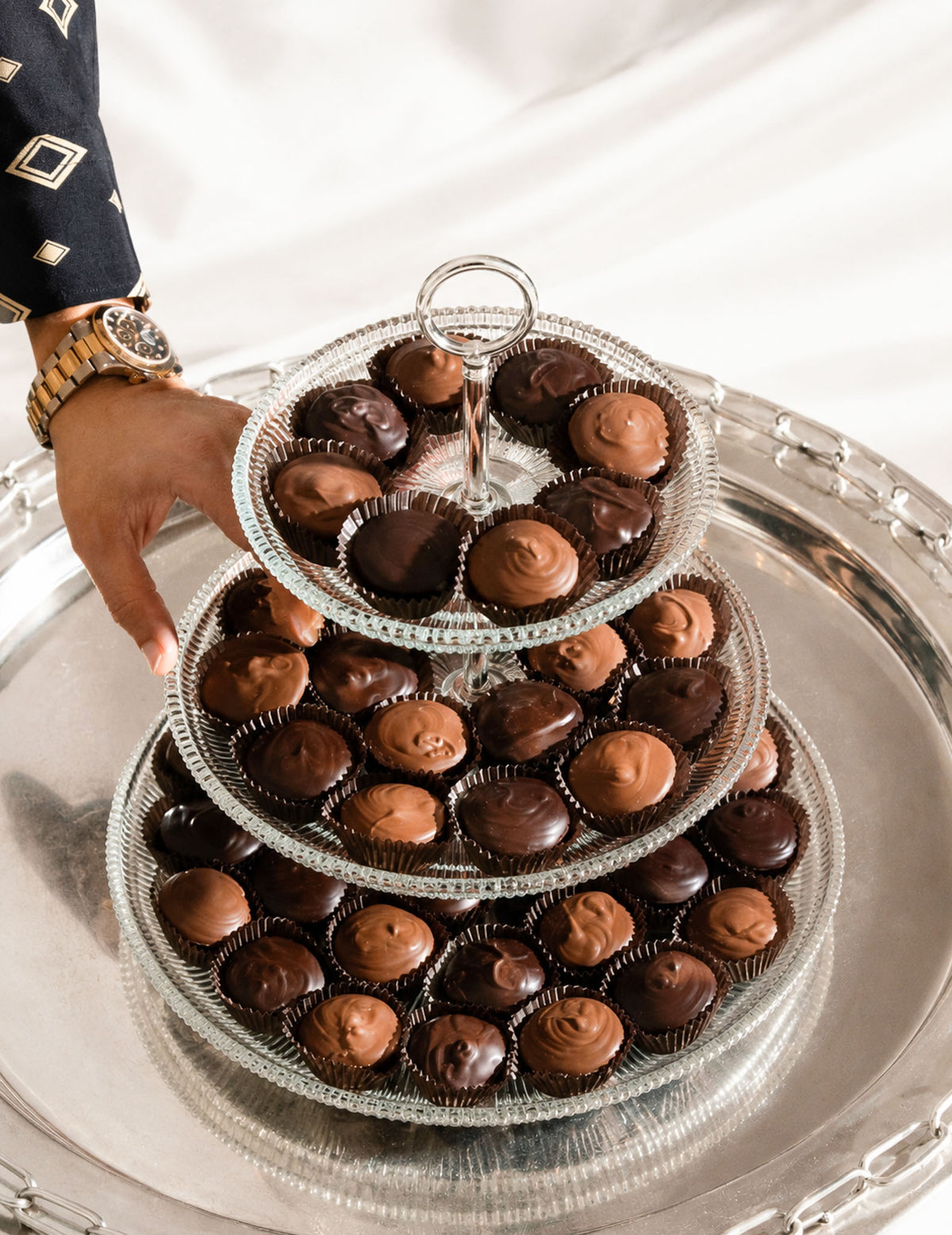 Gourmet Chocolate Peanut Butter Cups in a gorgeous glass and silver tray by Compartes Chocolatier