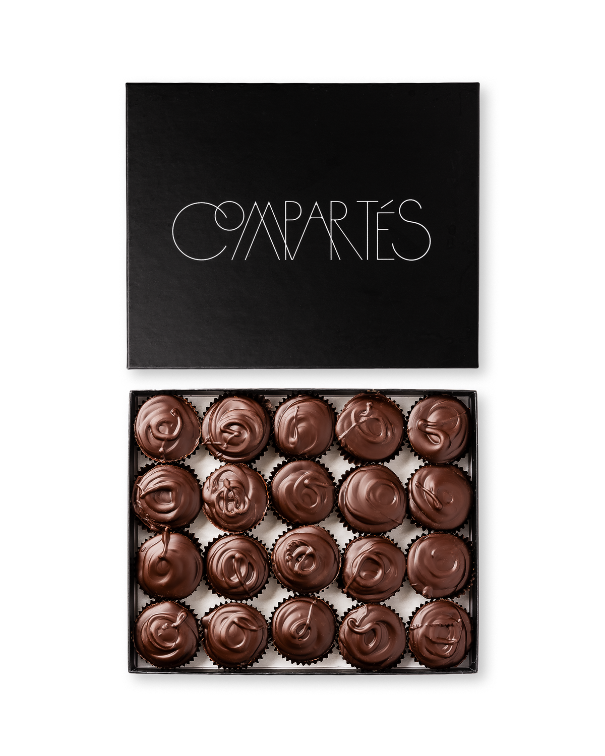 Compartes gourmet peanut butter cups in dark chocolate, swirled tops in a black gift box