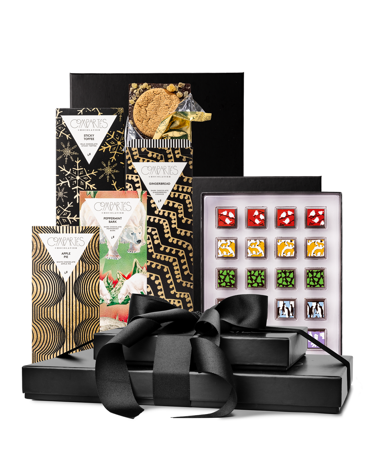 Compartes best Christmas chocolate gift tower, black boxes with a ribbon, gold snowflake bars and truffles