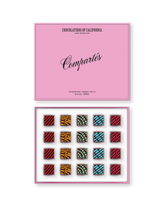 Compartes gourmet Vegan chocolate truffles in a pink gift box, squares in rich red, gold and blue patterns