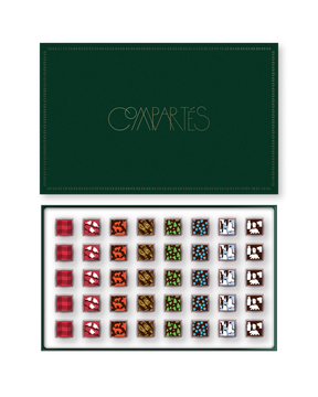 Compartes Christmas chocolates in a luxury deep green limited edition gift box, squares with plaid and animal motifs