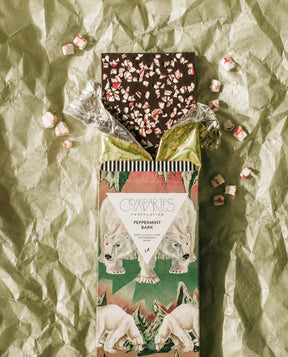 A Christmas Chocolate Bar of Peppermint Bark Dark Chocolate by Compartes Chocolatier Los Angeles. Gourmet Chocolate Peppermint Bark in a luxury chocolate gift box wrapped bar.