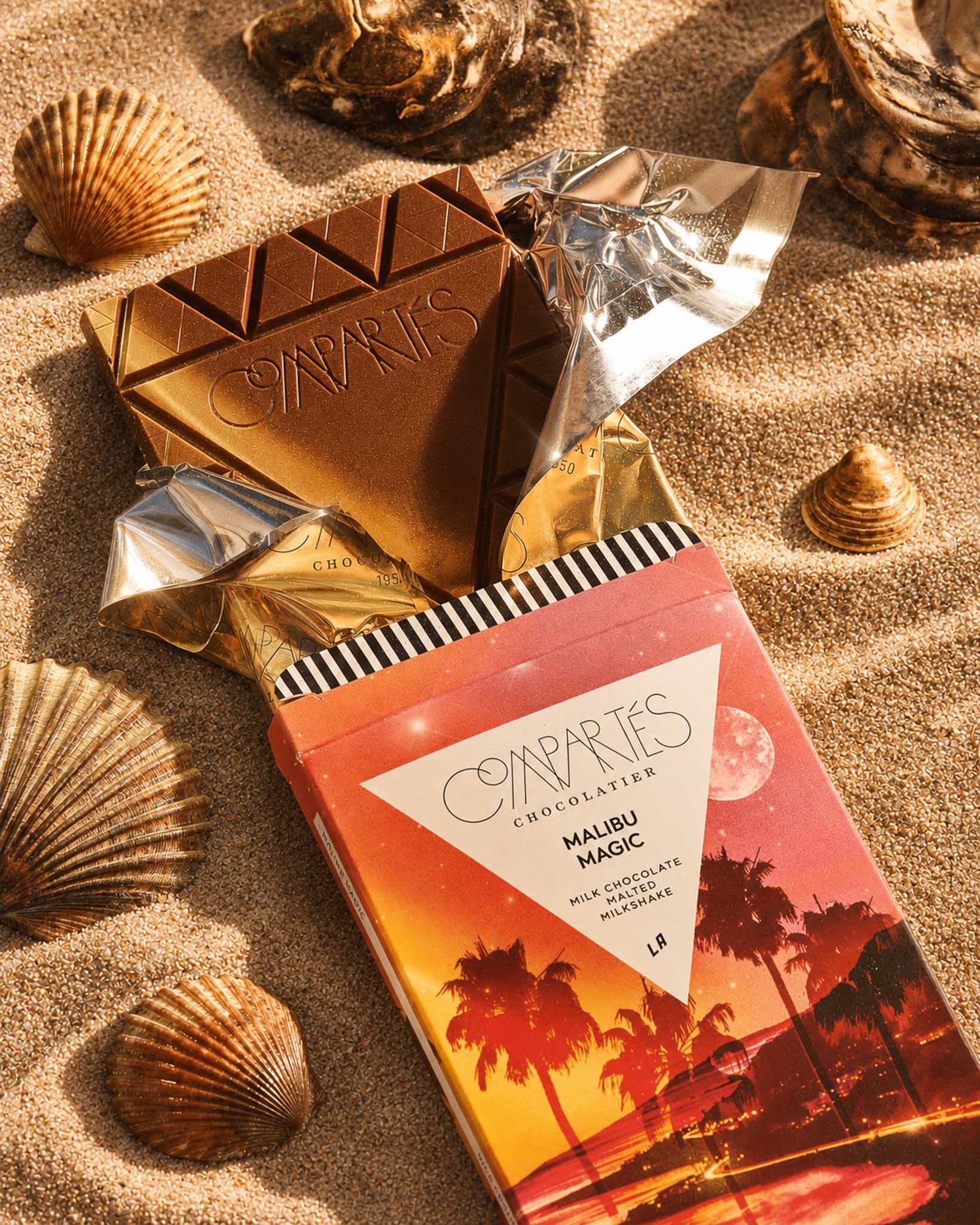 Gourmet Milk Chocolate Bar by Compartes Los Angeles filled with premium milk chocolate sea salt malt balls and malted milk in a gorgeous California sandscape.