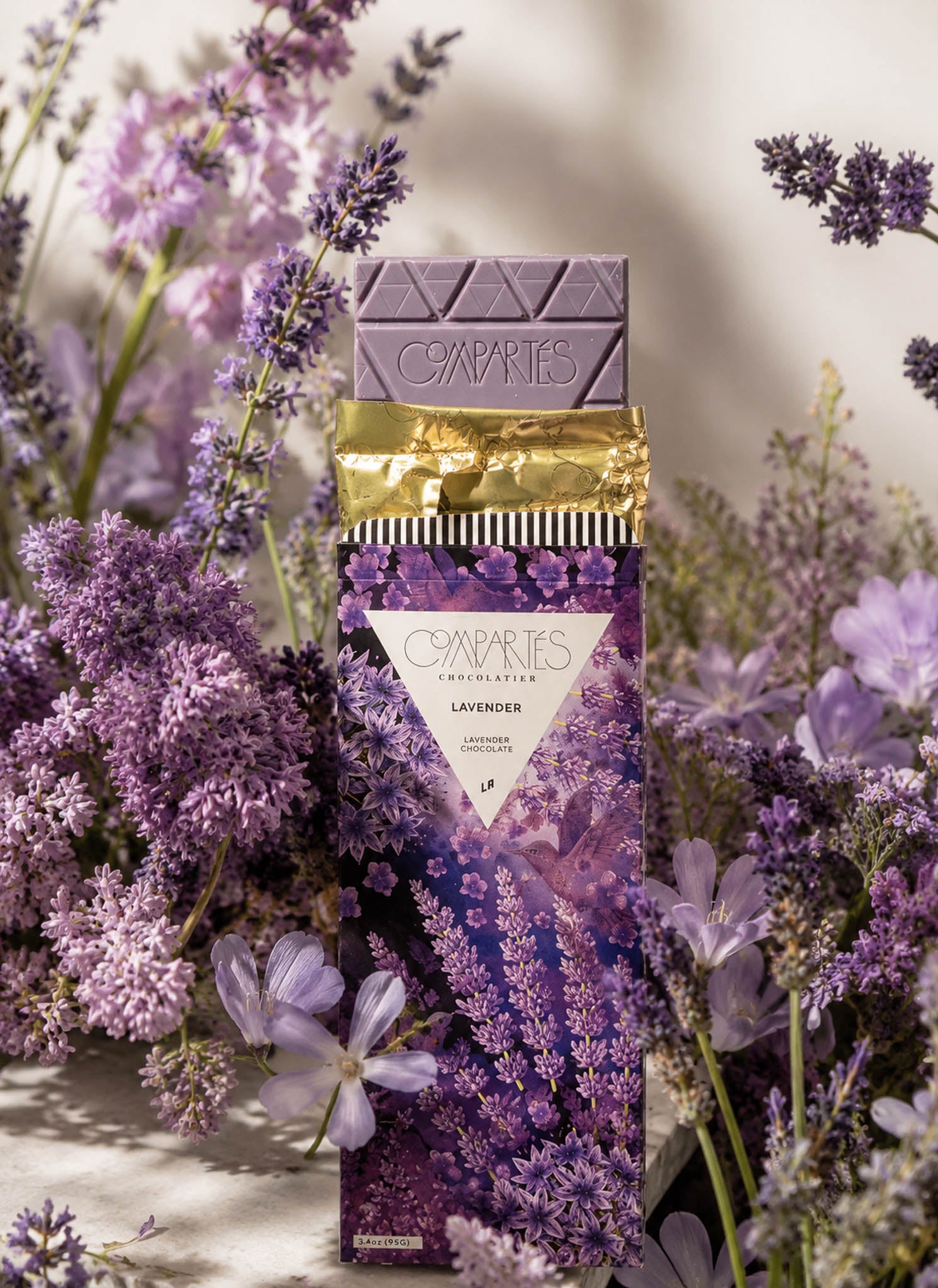 Gourmet Lavender Chocolate Bar by Compartes Chocolatier Los Angeles. Handmade luxury chocolate gifts made in LA infused with lavender in designer chocolate packaging. 