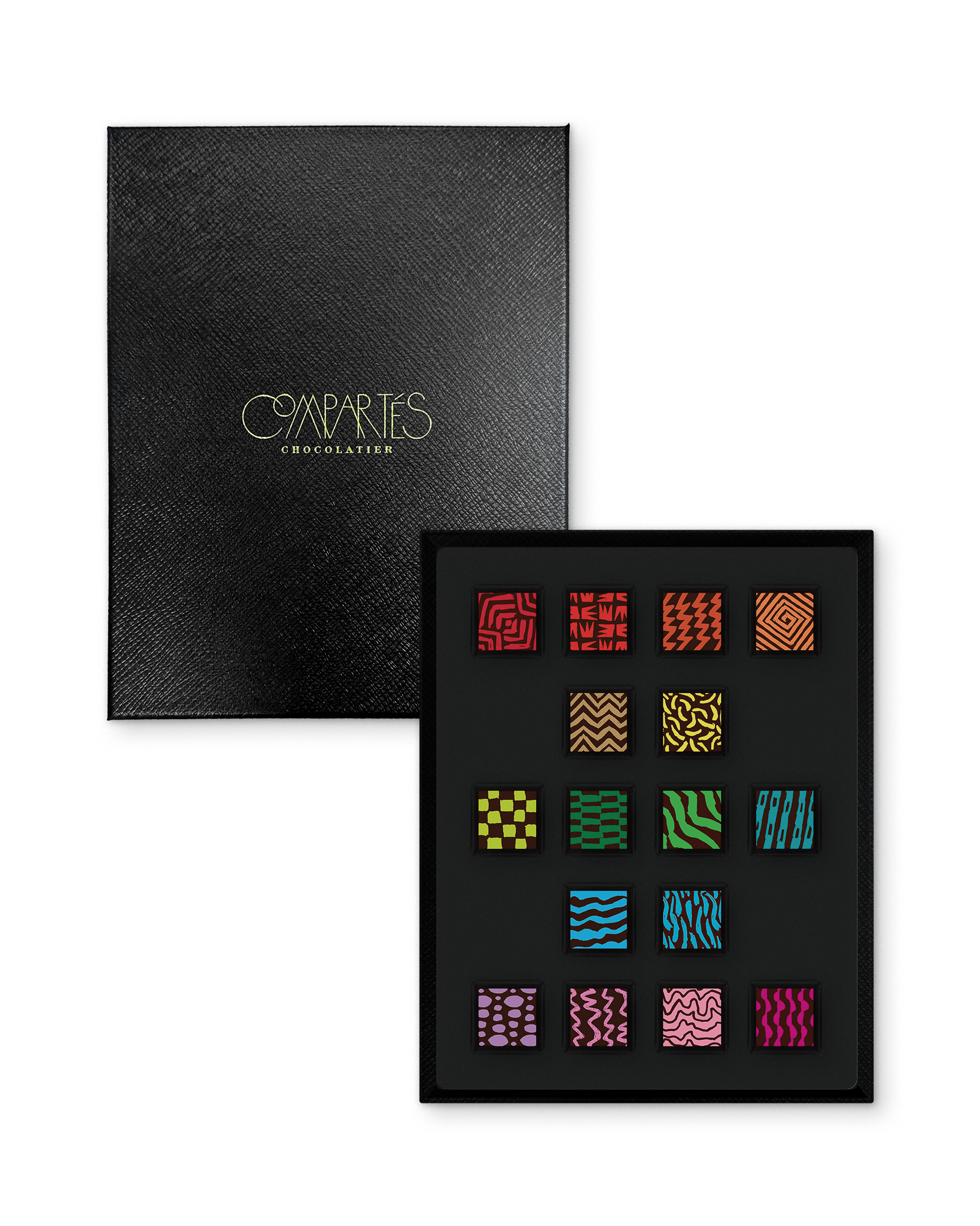 Compartes best chocolate gift box, patterned truffles in rich red, green and pink, black leathered lid