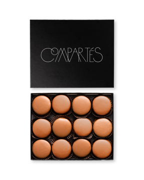 Compartes best milk chocolate dipped sandwich cookies, smooth round pieces in a black gift box