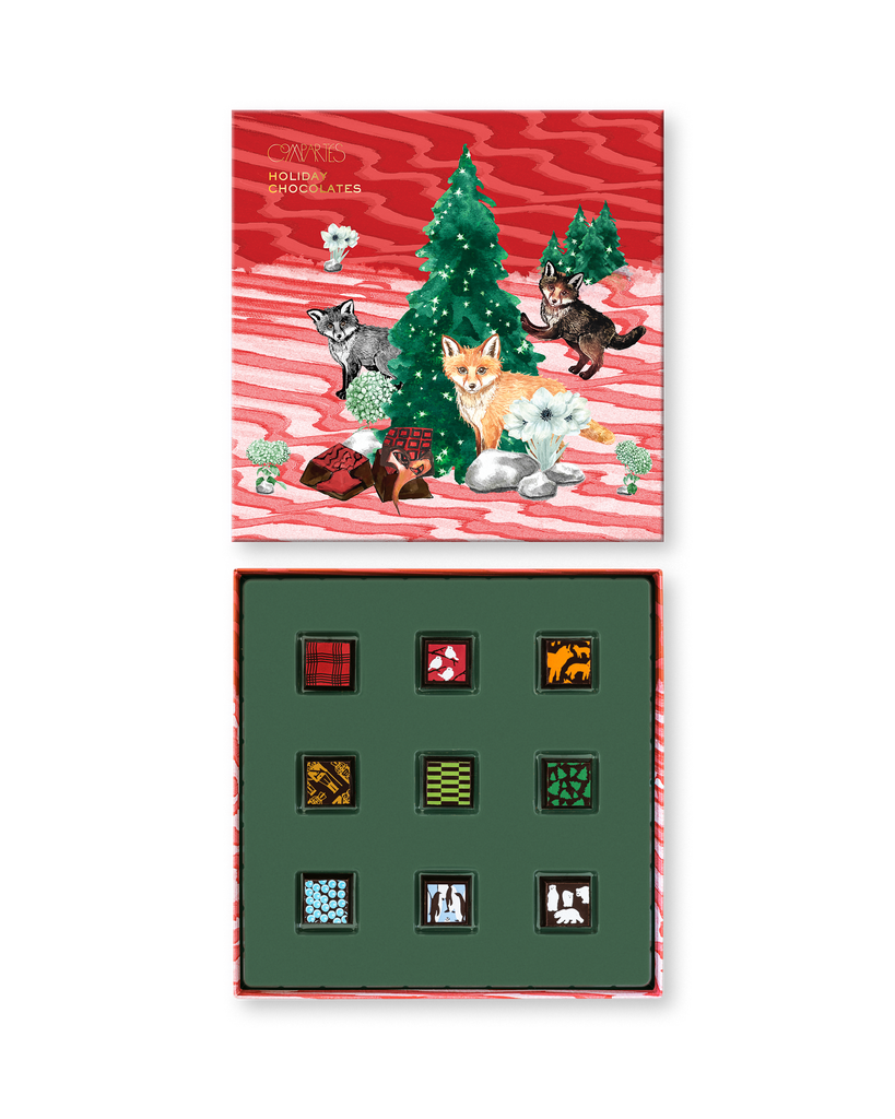 Compartes gourmet Christmas chocolate truffles gift box, red lid with pine trees and foxes, patterned truffles
