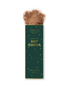 Compartes luxury milk hot cocoa mix, deep green and gold star box with cocoa powder, chocolate gift