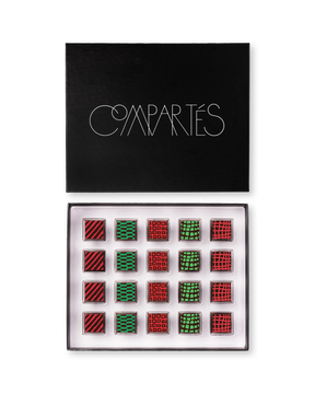 Compartes luxury Christmas chocolate truffles in a black gift box, squares in rich red and green patterns