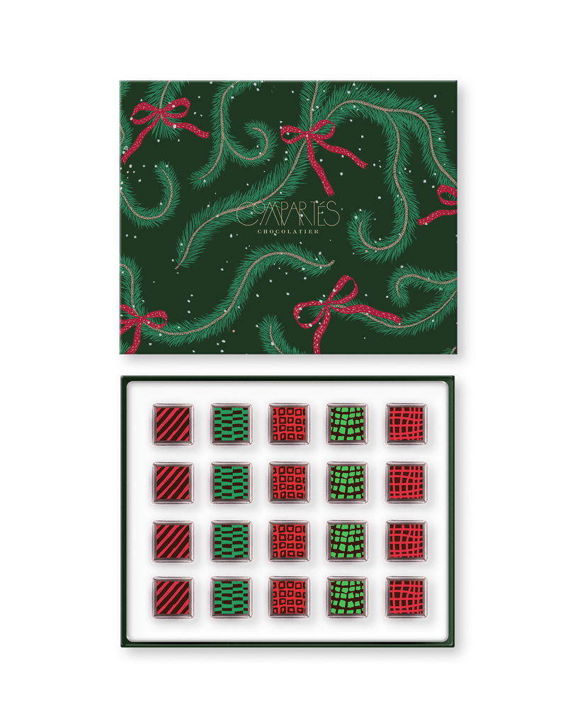 Compartes luxury Christmas chocolate truffles in a green pine print gift box, squares in rich red and green