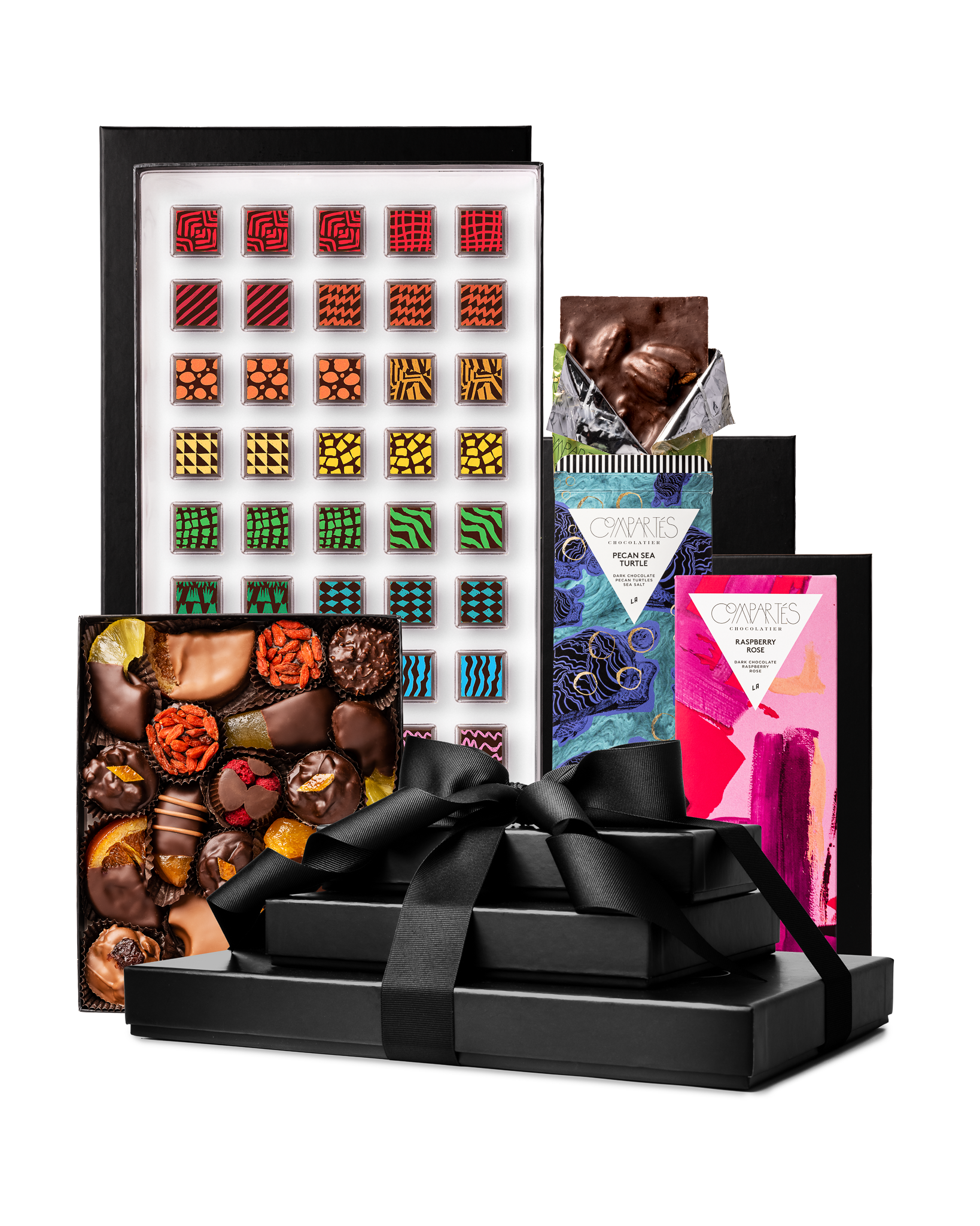 Compartes best deluxe chocolate tower gift, stacked black boxes with a ribbon, patterned truffles and bars