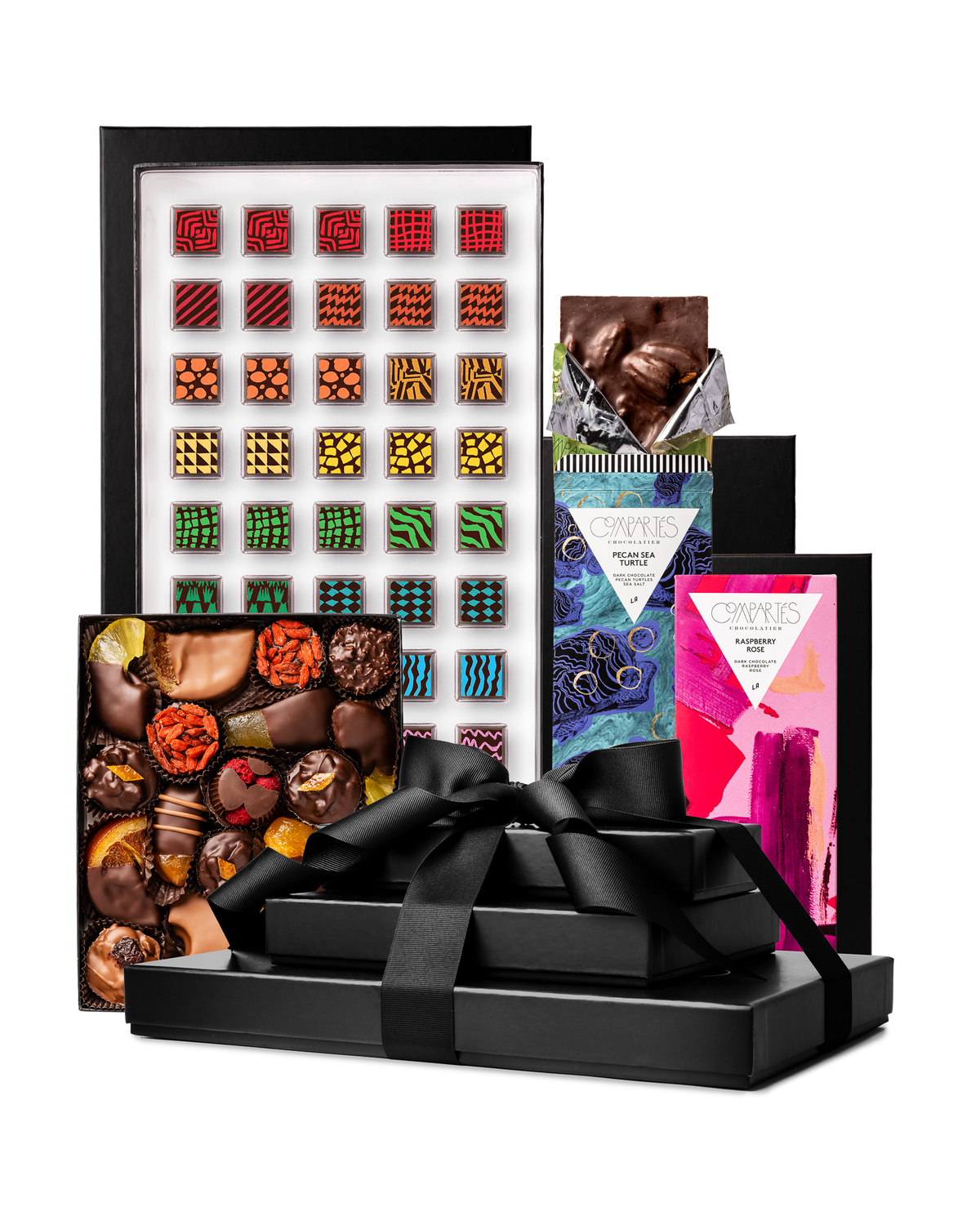Compartes best deluxe chocolate tower gift, stacked black boxes with a ribbon, patterned truffles and bars