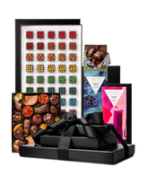 Compartes best deluxe chocolate tower gift, stacked black boxes with a ribbon, patterned truffles and bars