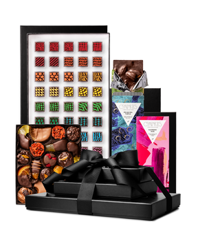 Compartes best deluxe chocolate tower gift, stacked black boxes with a ribbon, patterned truffles and bars
