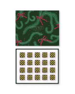 Compartes gourmet Dubai chocolate pistachio bites in a green pine print gift box, squares in deep yellow checks, knafeh