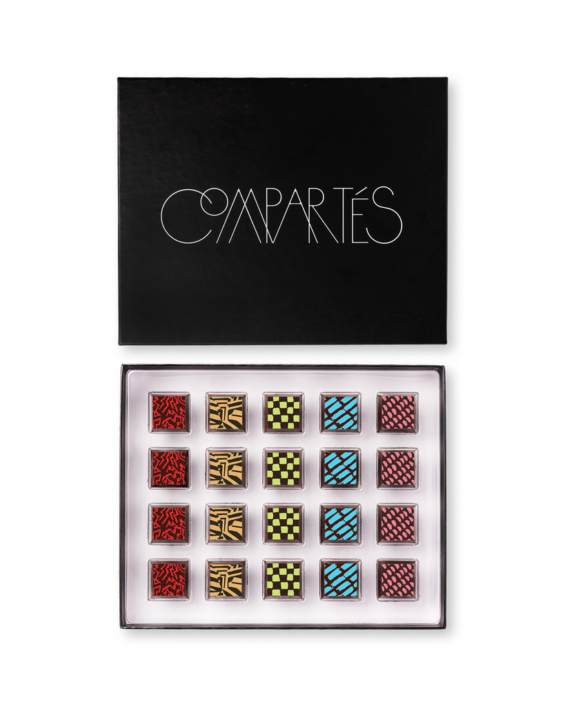 Compartes gourmet gluten free chocolate truffles in a black gift box, squares in rich red, gold and blue patterns