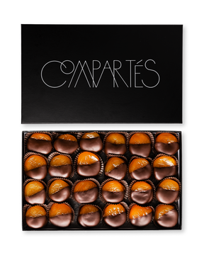 Compartes gourmet dark chocolate covered apricots in a black gift box, whole apricots dipped in chocolate