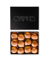 Compartes gourmet milk chocolate dipped apricots, smooth milk chocolate pieces in a black gift box