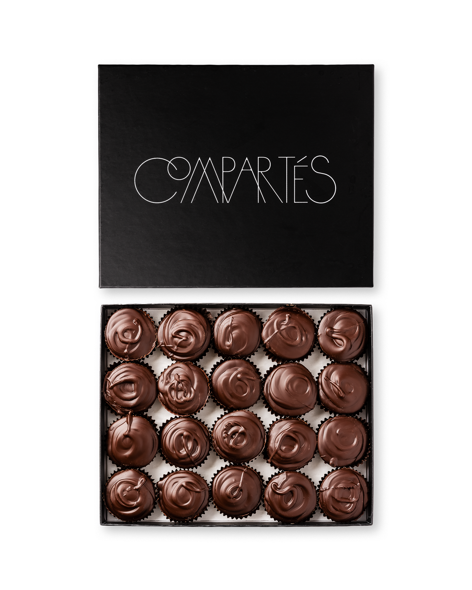 Compartes gourmet peanut butter cups in dark chocolate, swirled tops in a black gift box