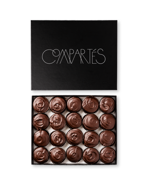 Compartes gourmet peanut butter cups in dark chocolate, swirled tops in a black gift box