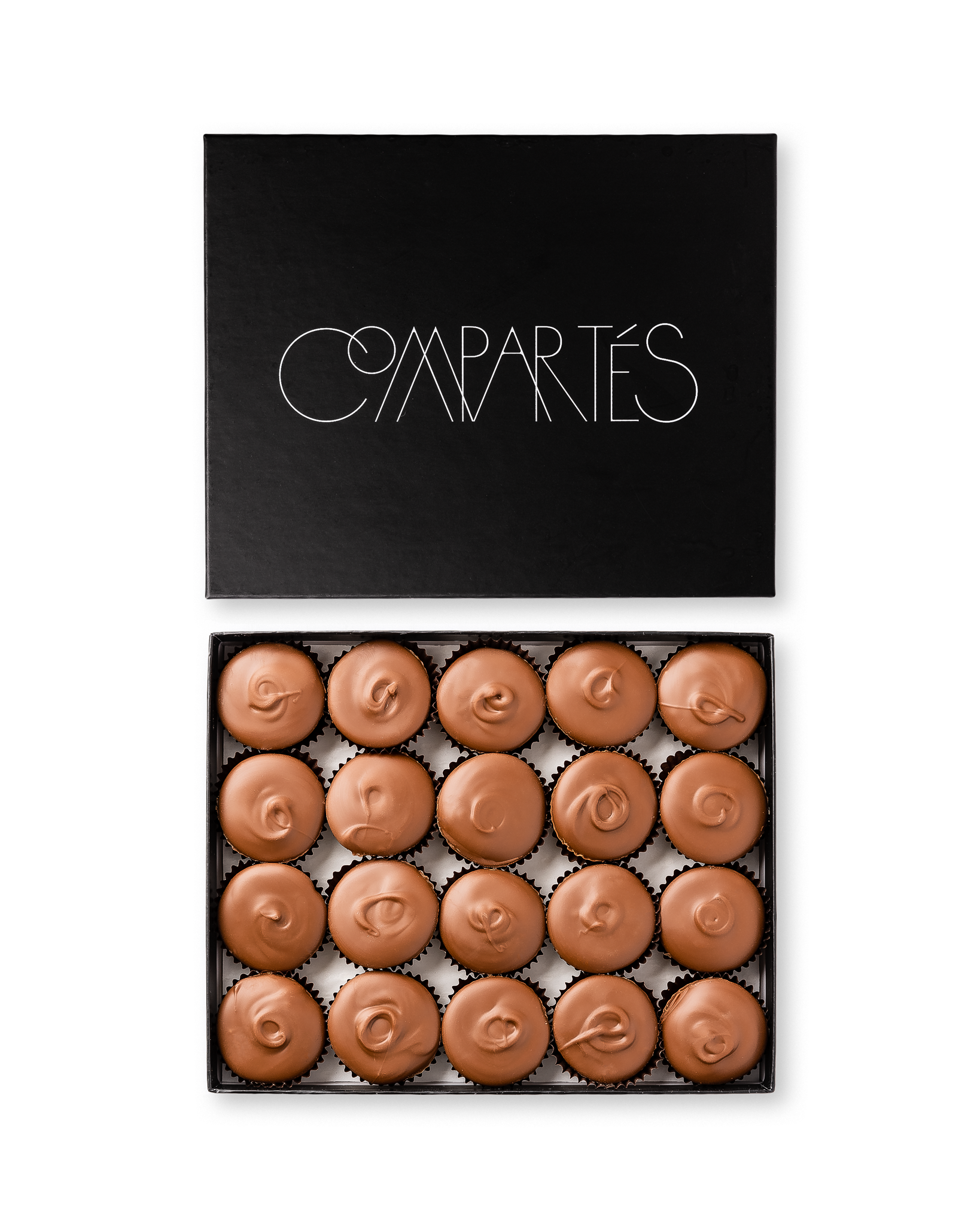 Compartes gourmet peanut butter cups in milk chocolate, swirled tops in a black gift box