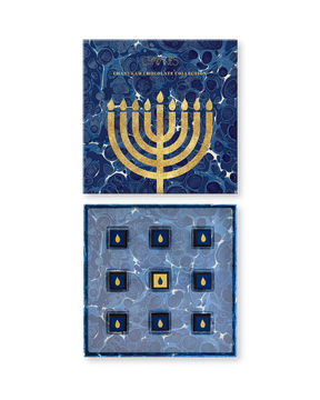 Compartes luxury Hanukkah chocolate gift box, blue marbled lid with a gold menorah, chocolates with gold flames