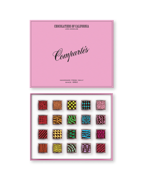 Compartes luxury signature chocolate truffles in a pink gift box, squares in rich red, green and teal patterns