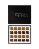 Compartes best boozy chocolate gift box, gold patterned truffles under a black lid, champagne and whiskey