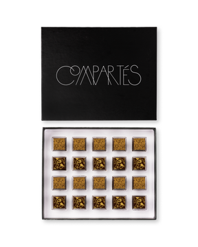 Compartes best boozy chocolate gift box, gold patterned truffles under a black lid, champagne and whiskey