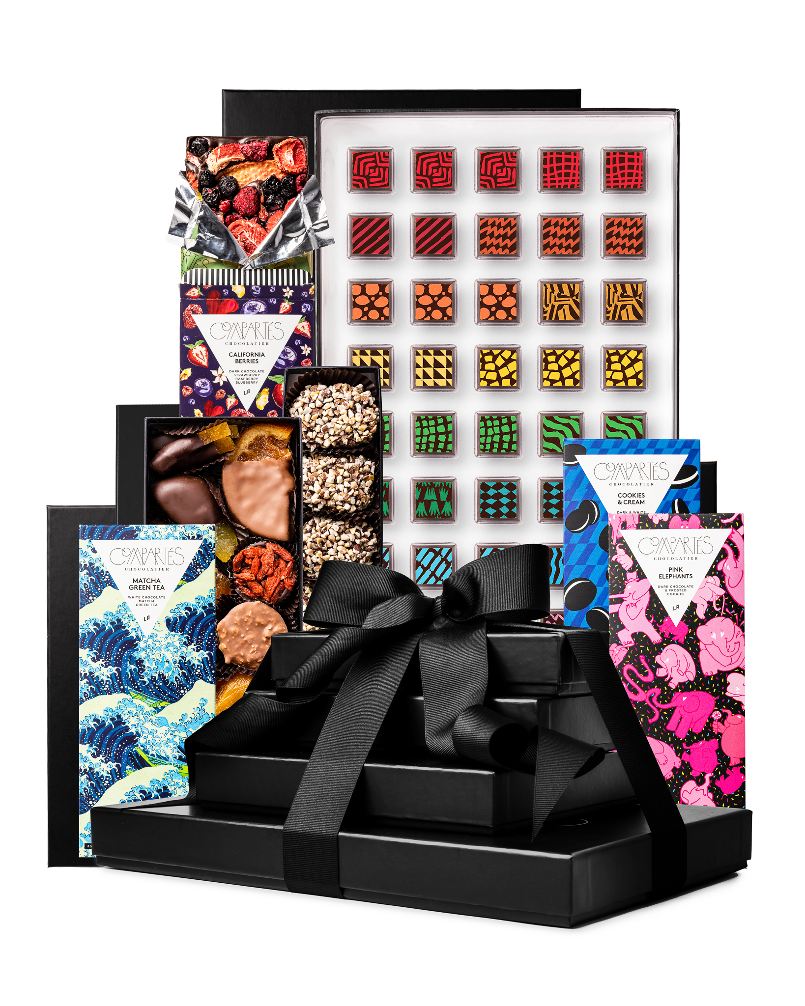 Compartes best chocolate gift tower, stacked black boxes with a satin bow, patterned truffles and bars