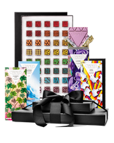 Compartes gourmet chocolate gift tower, black boxes with a satin bow, patterned truffles and illustrated bars