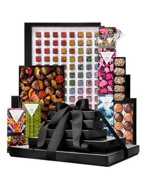 Compartes gourmet chocolate gift tower, black boxes with a satin bow, patterned truffles, bars and clusters