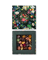 Compartes luxury chocolate fruit gift box, dark chocolate dipped fruit under a deep green botanical lid