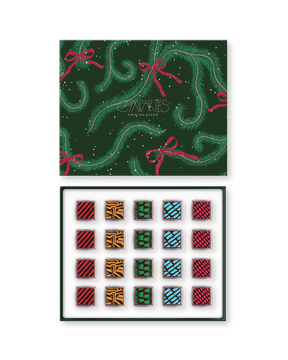 Compartes best Vegan chocolate truffles in a green pine print gift box, squares in rich red, gold and teal patterns