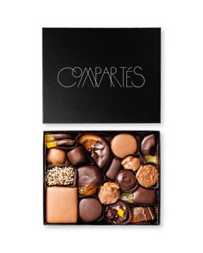 Compartes world famous gourmet chocolates, dark and milk chocolate pieces in a black gift box